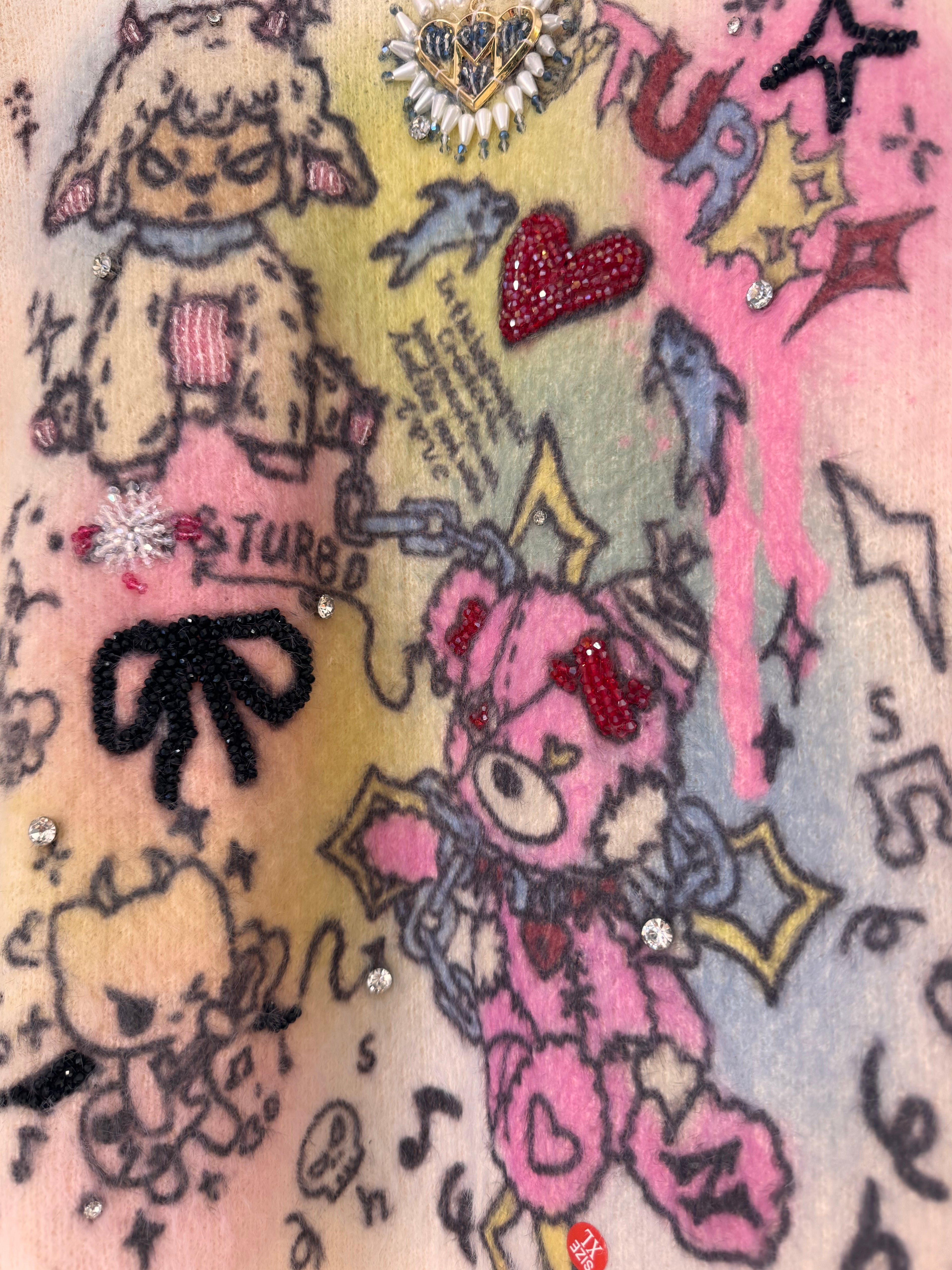 CREAM SWEATER WITH PASTEL CARTOON PRINT