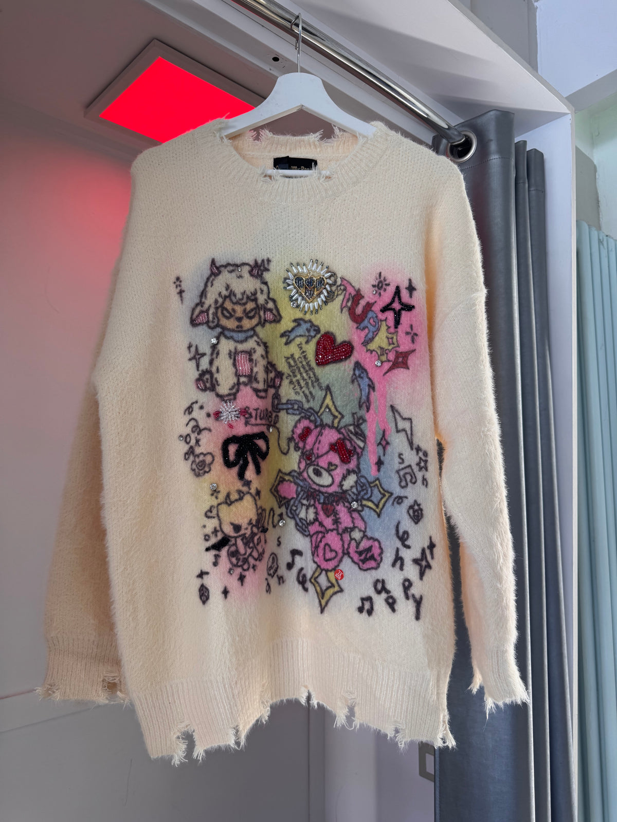 CREAM SWEATER WITH PASTEL CARTOON PRINT