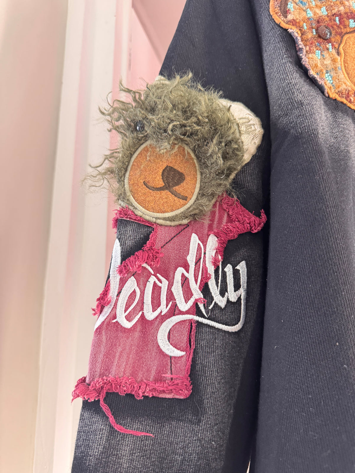 BLACK JACKET WITH BEAR